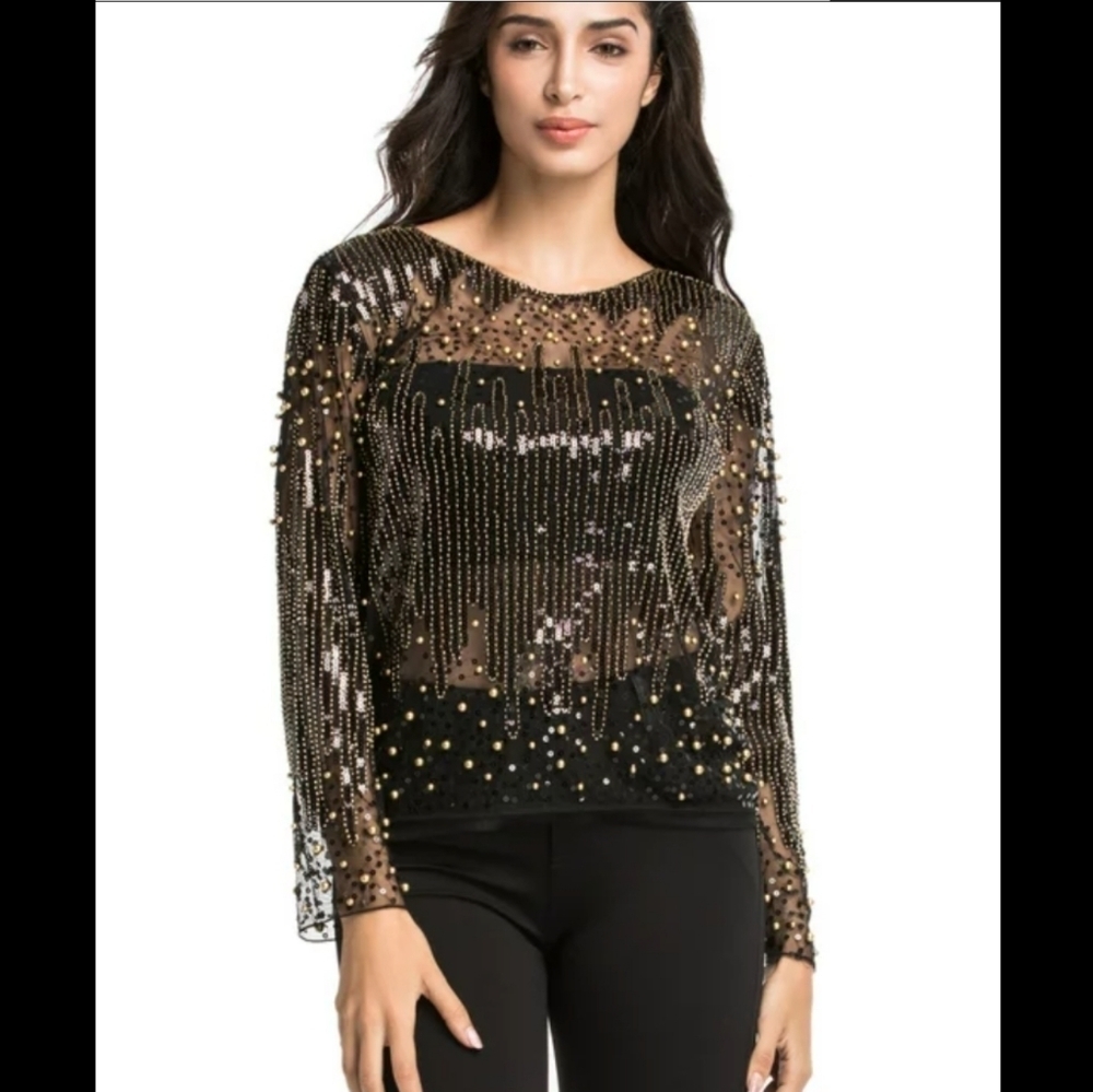 Beaded black and gold blouse.25